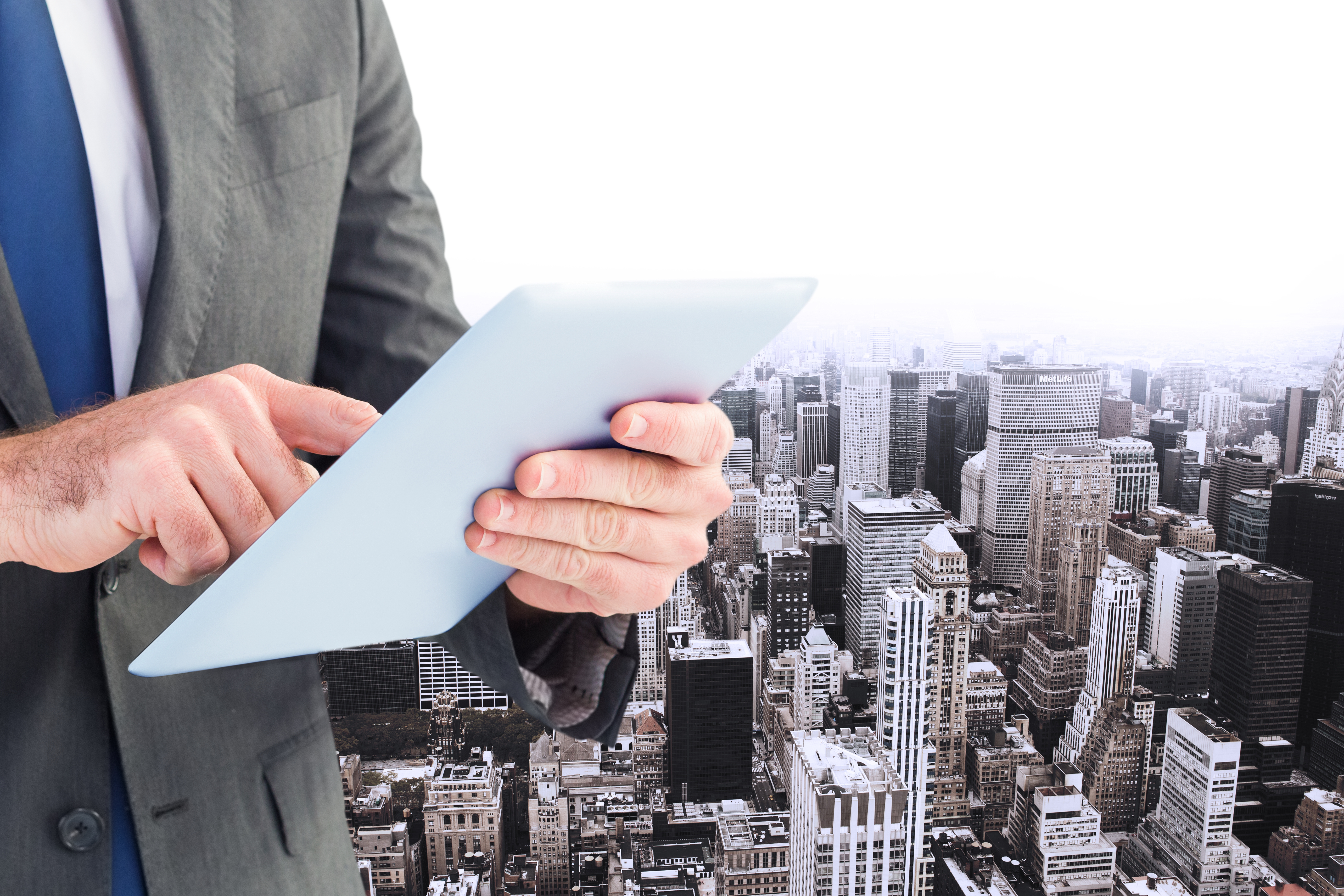 Executive with Tablet and Buildings